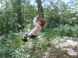 Child on a rope swing